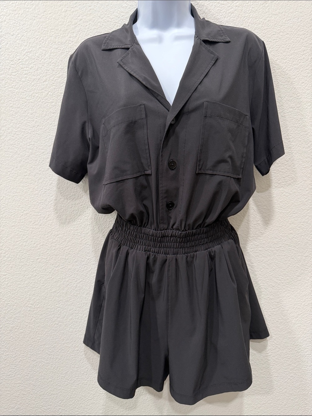VUORI Black Short-Sleeve Romper with Smocked Waist